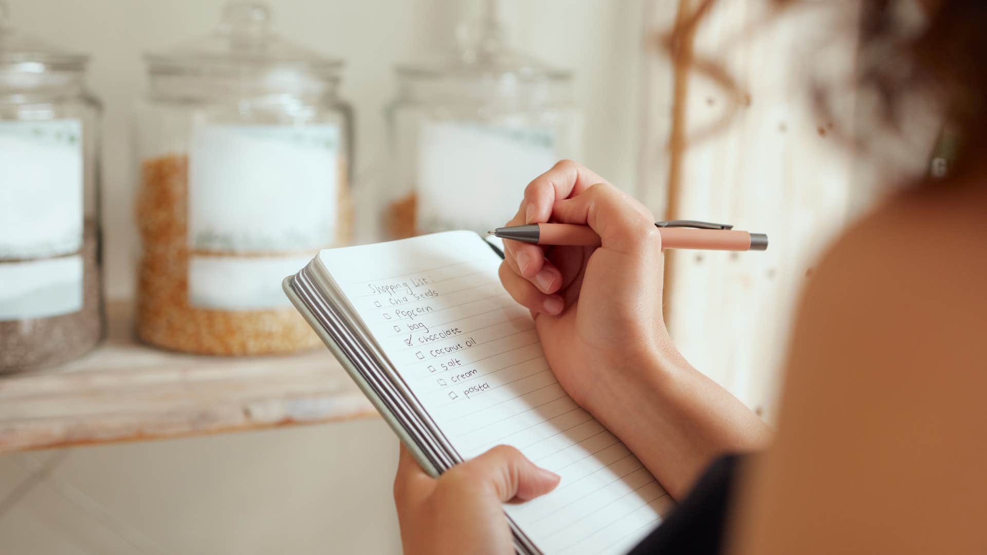 frugal woman making a plan for the grocery store
