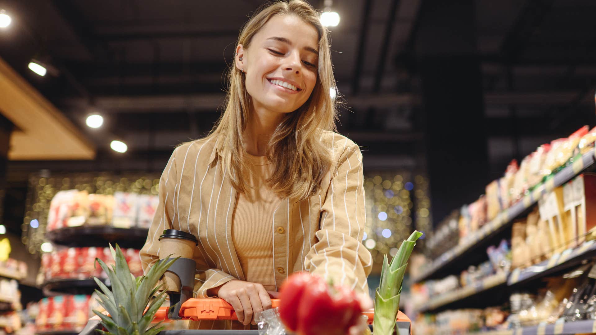 frugal woman at the grocery store shopping alone