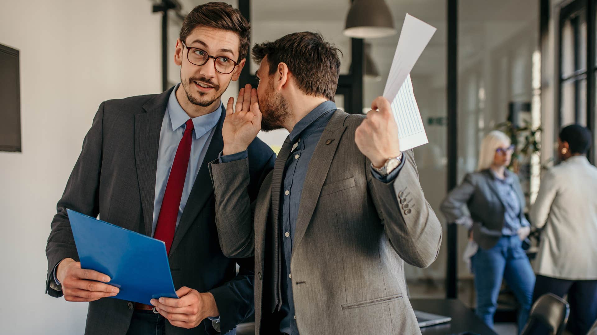 Men gossiping in their work office.