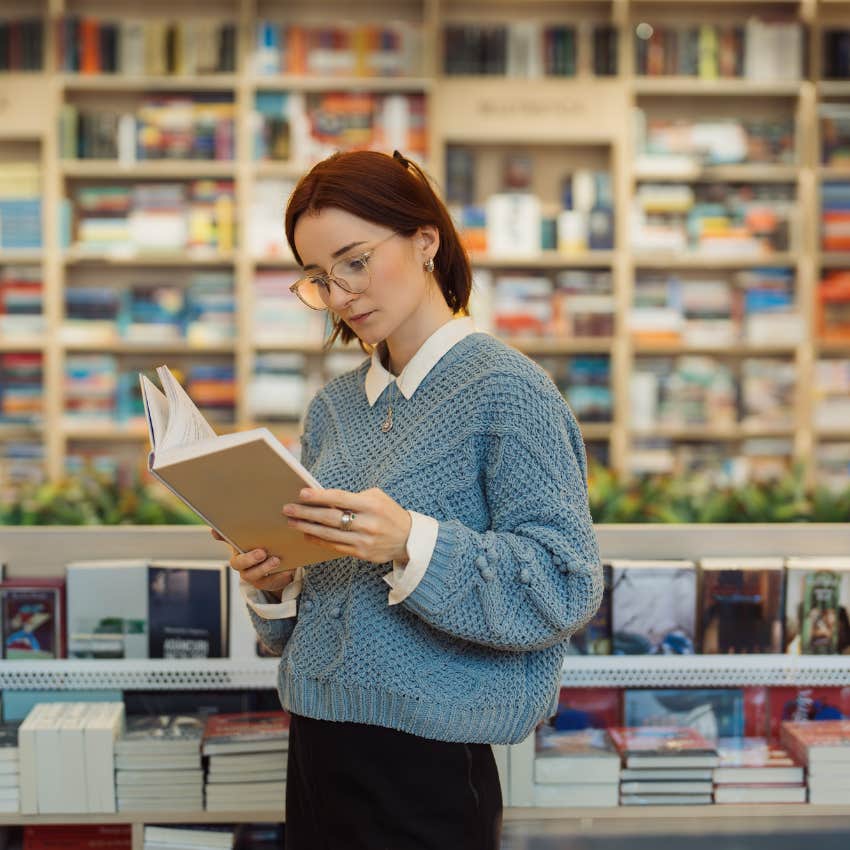 woman with high iq reading a book that normal people find tedious