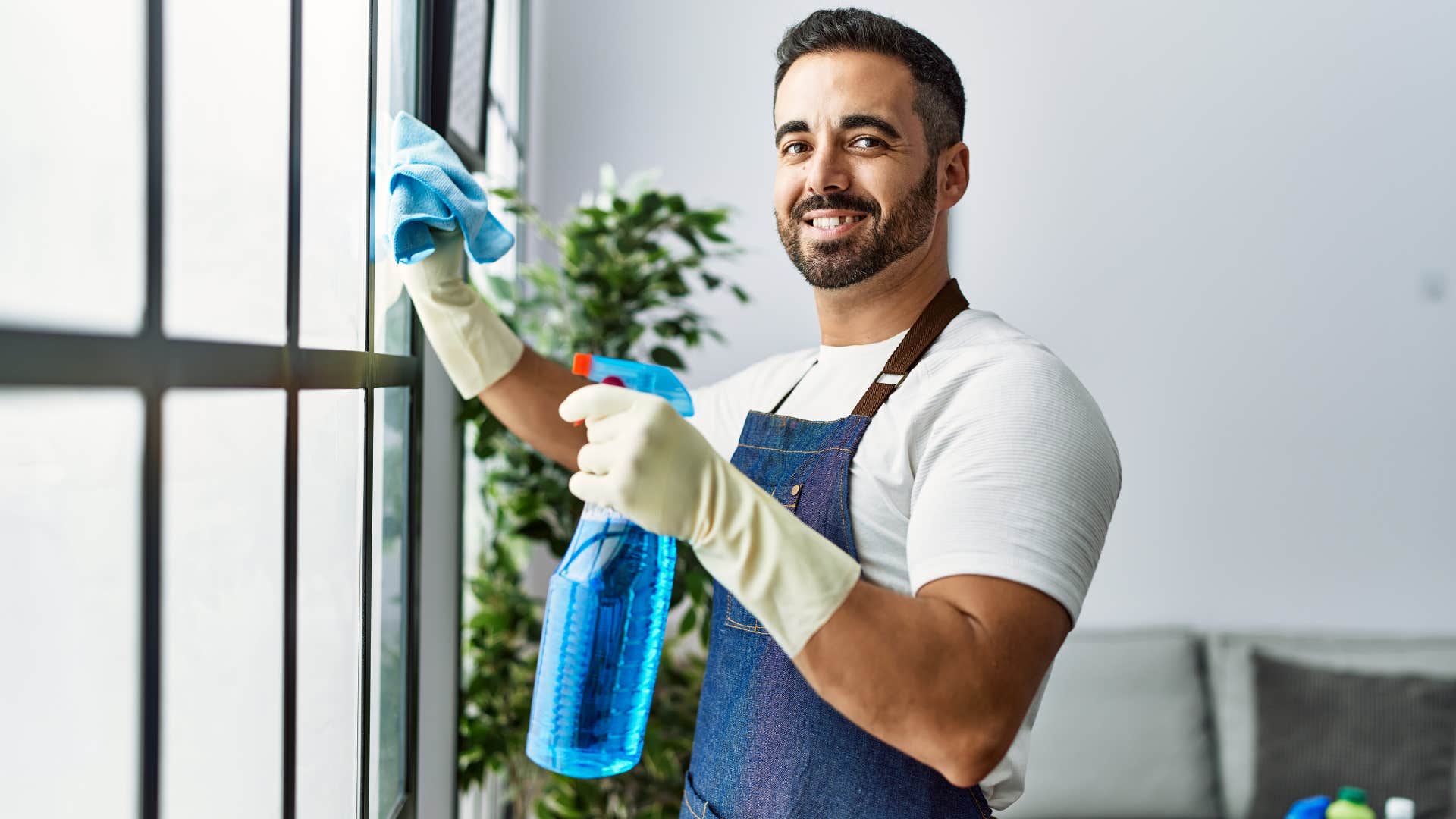Man dealing with cleanliness at home.
