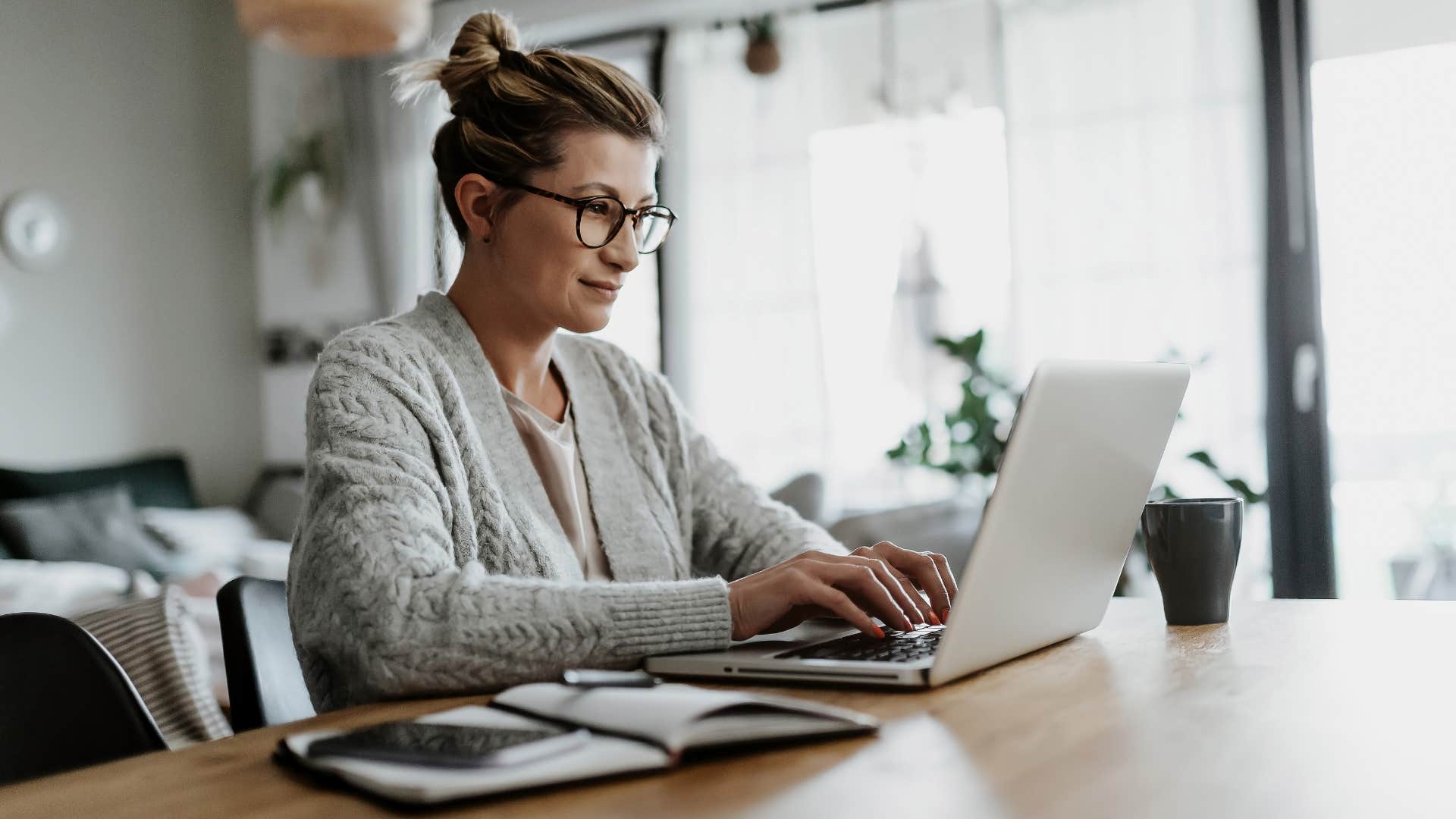 Woman working in her home office.