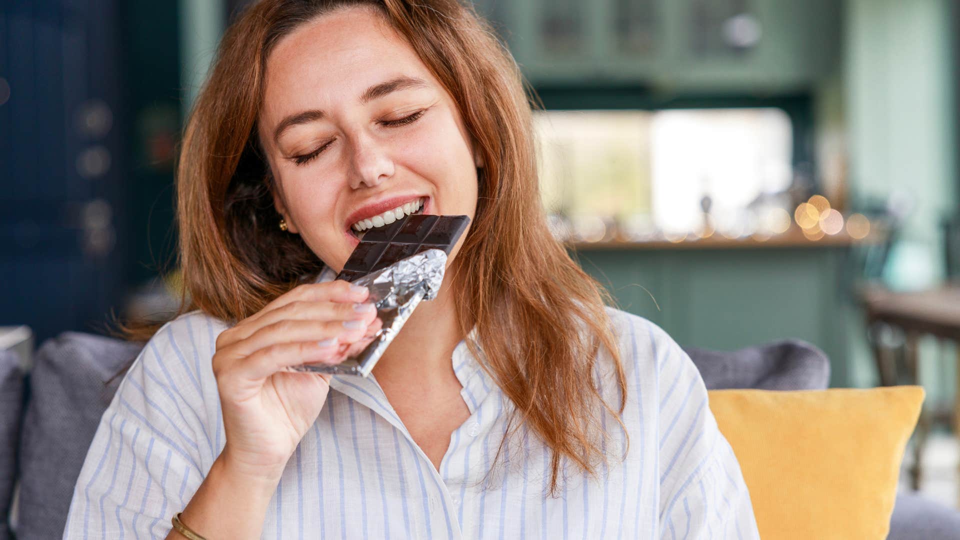 woman not feeling guilty for eating dark chocolate