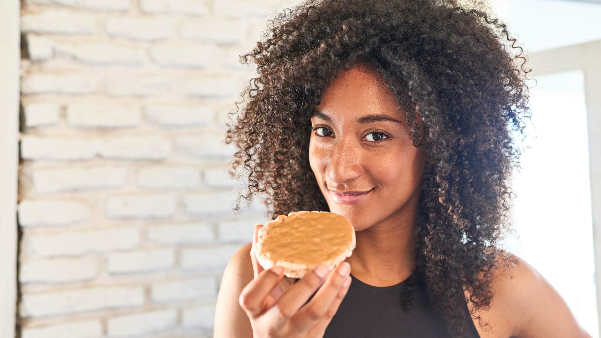 woman not feeling guilty for eating peanut butter