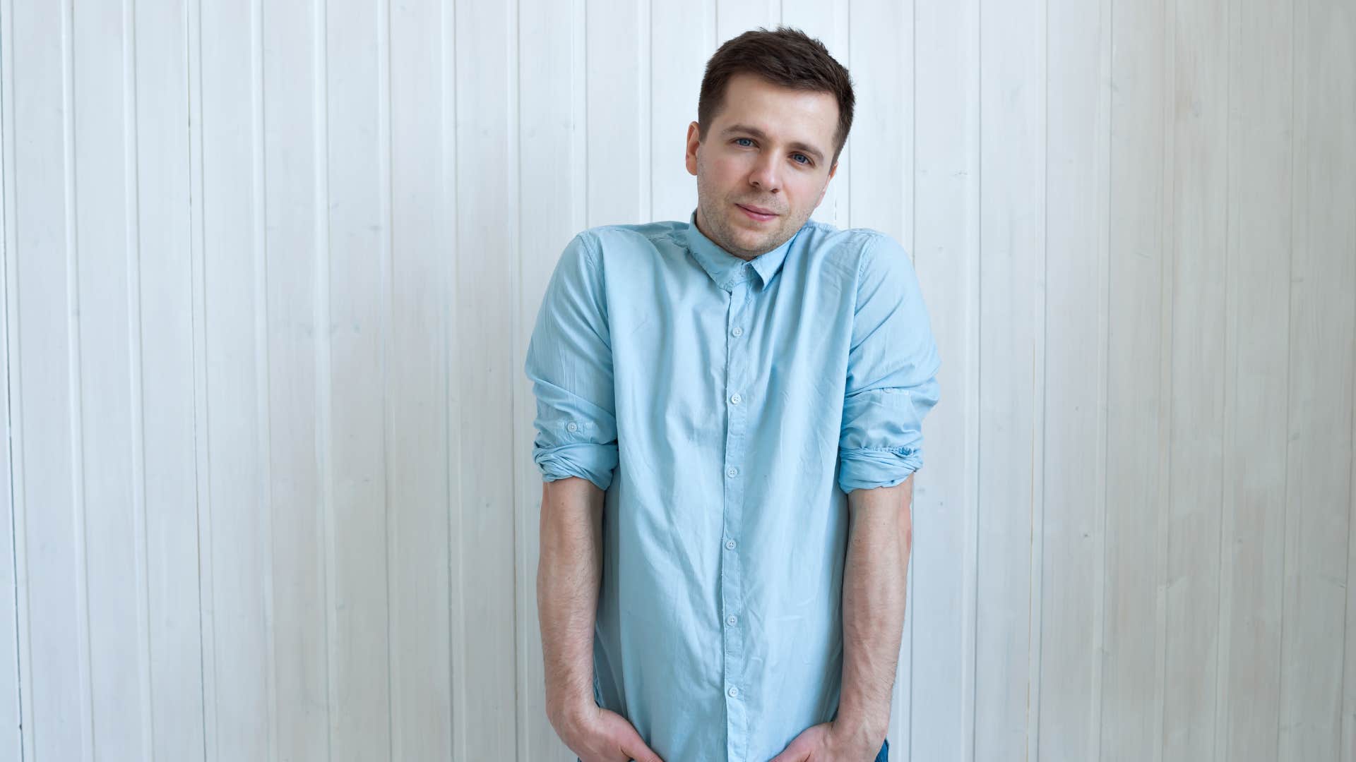 socially awkward man standing still