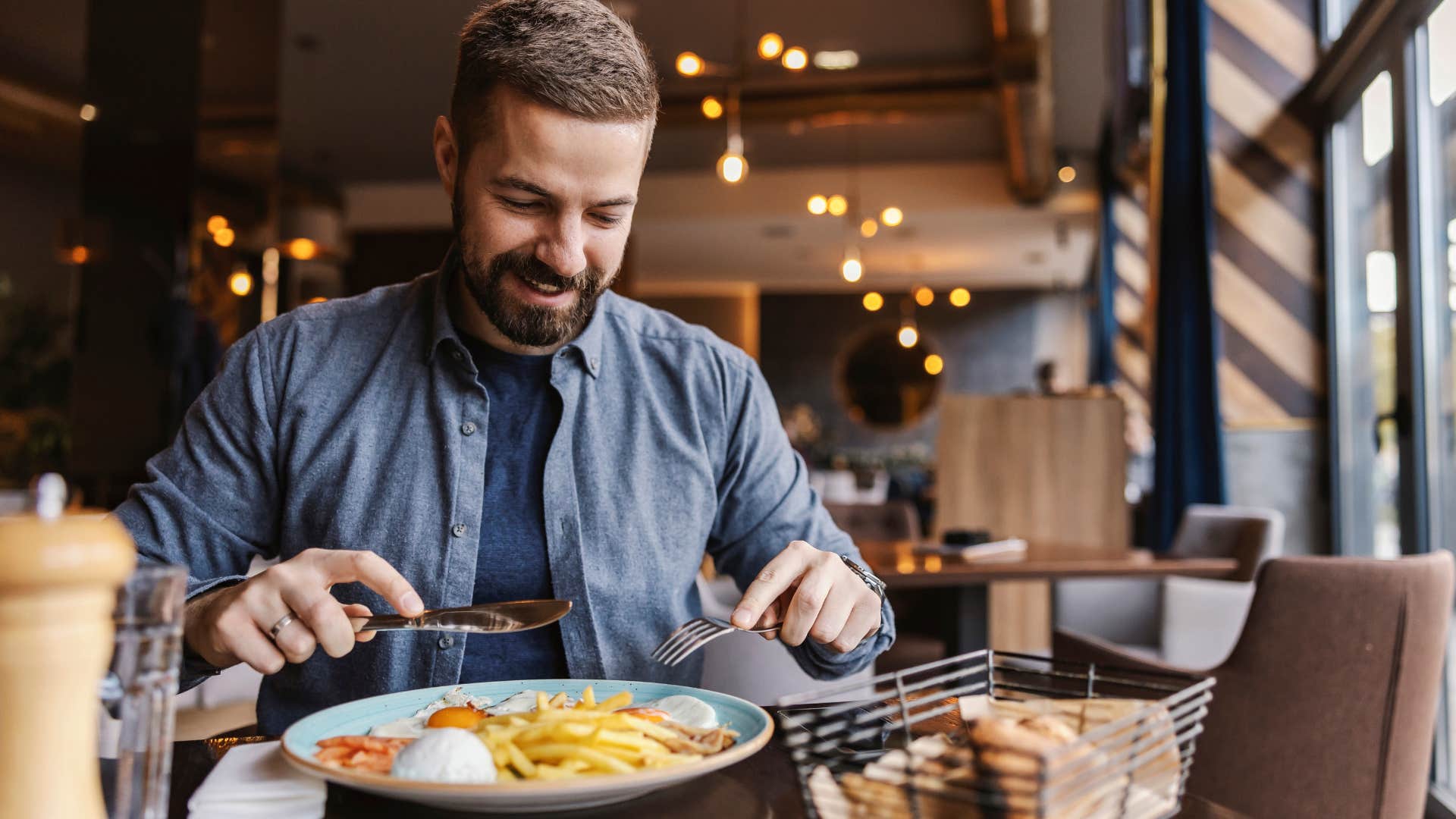 man going out alone eating at a restaurant