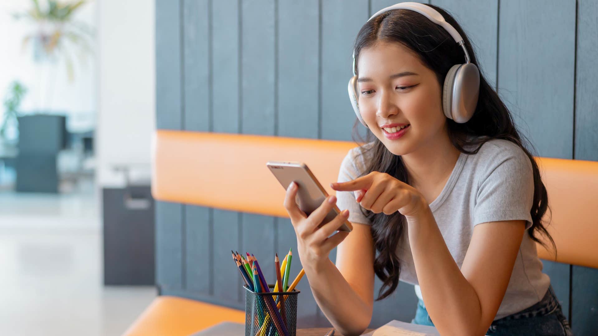 Woman passively listening to music on her phone.