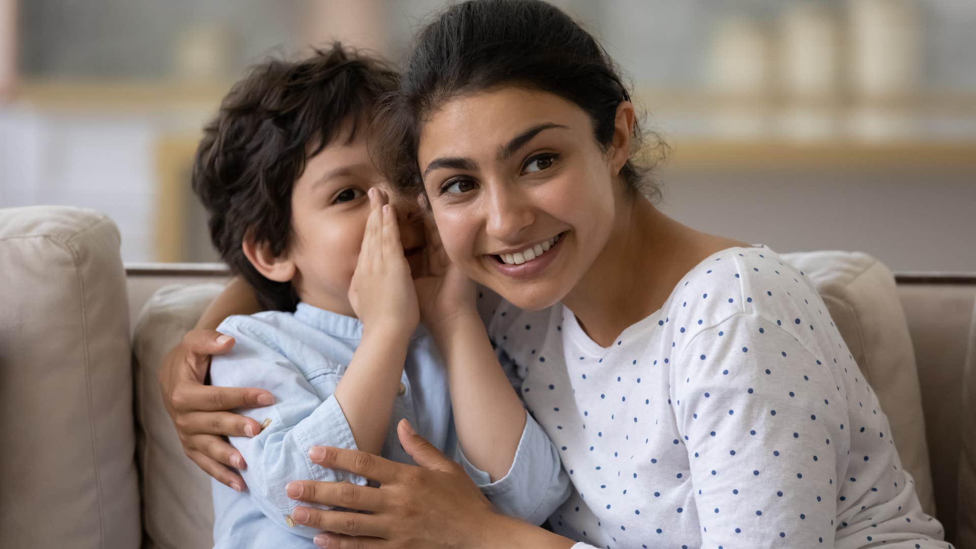 little boy talking to a babysitter at home