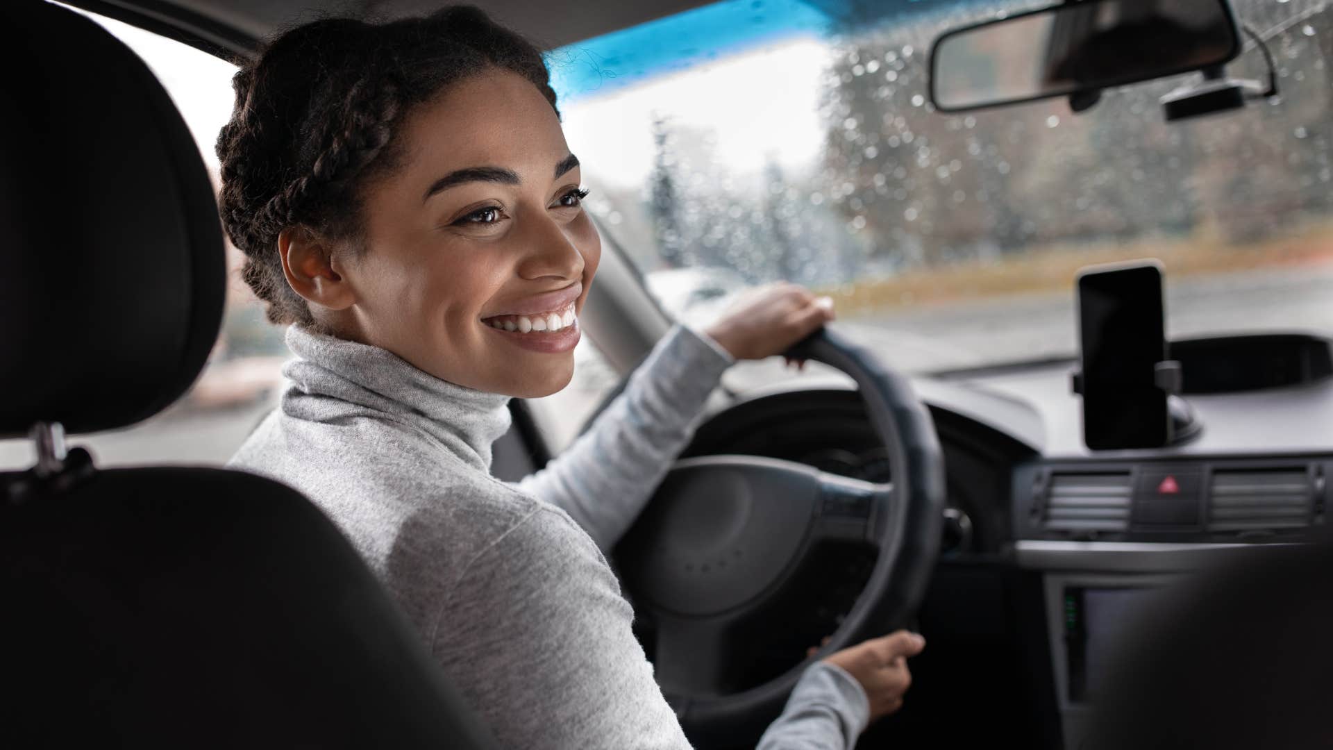 woman without multiple cars driving hers outside