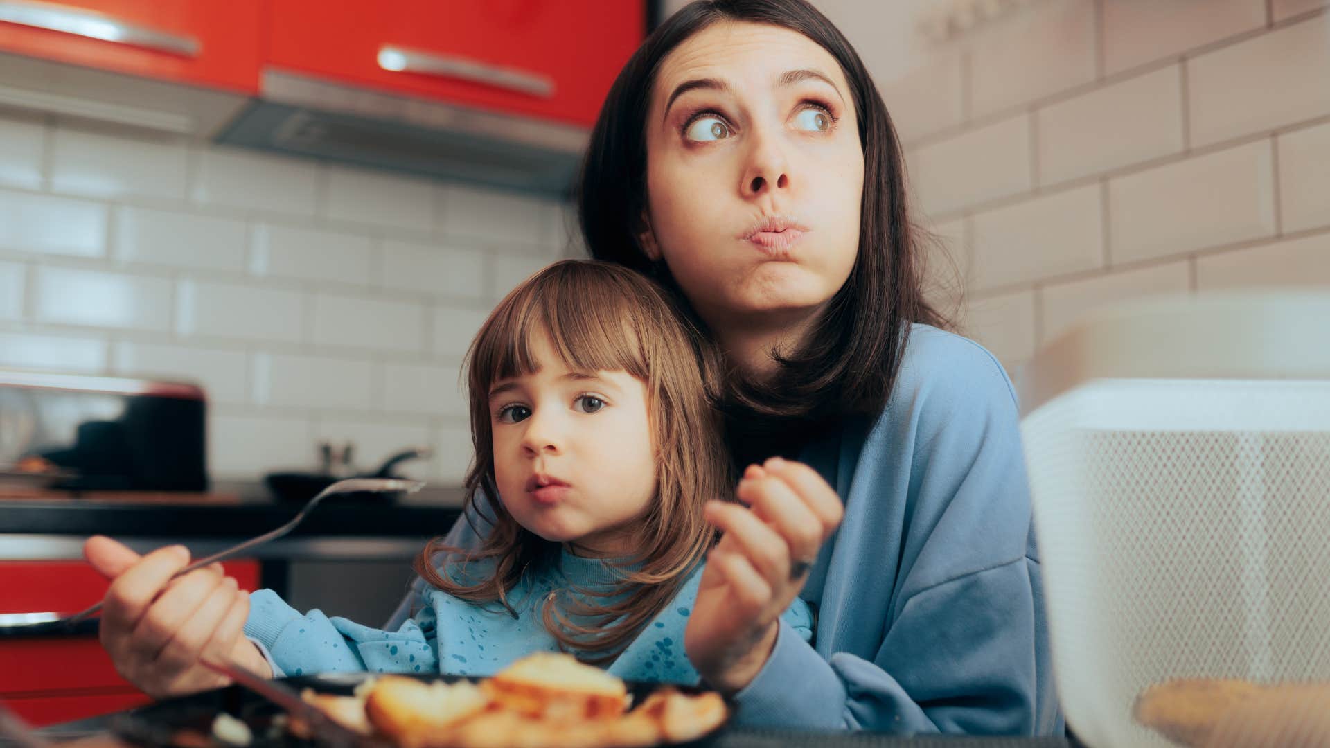woman without regular mealtimes trying to eat with her daughter