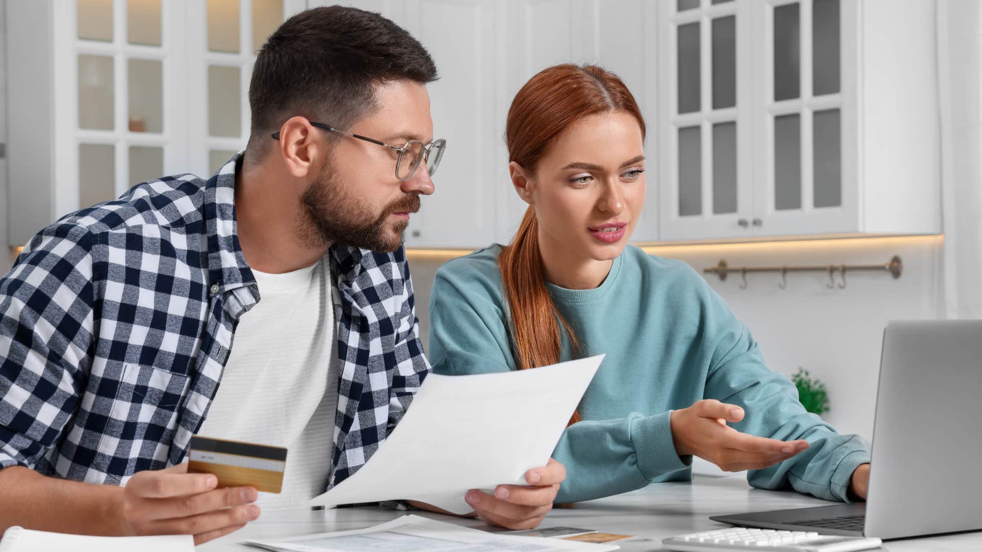 couple doing bills and talking about a second income