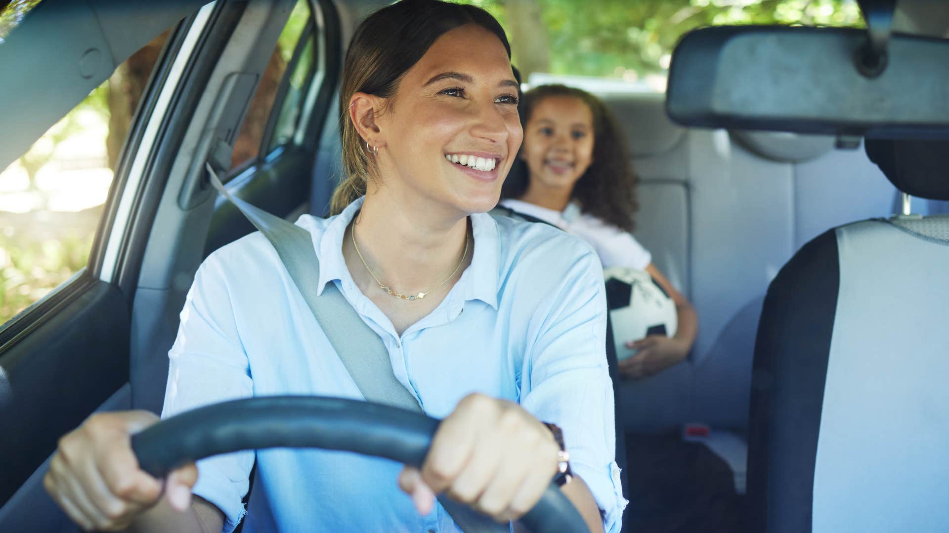 mom who's not stressed about appointments or pick-ups driving her kids
