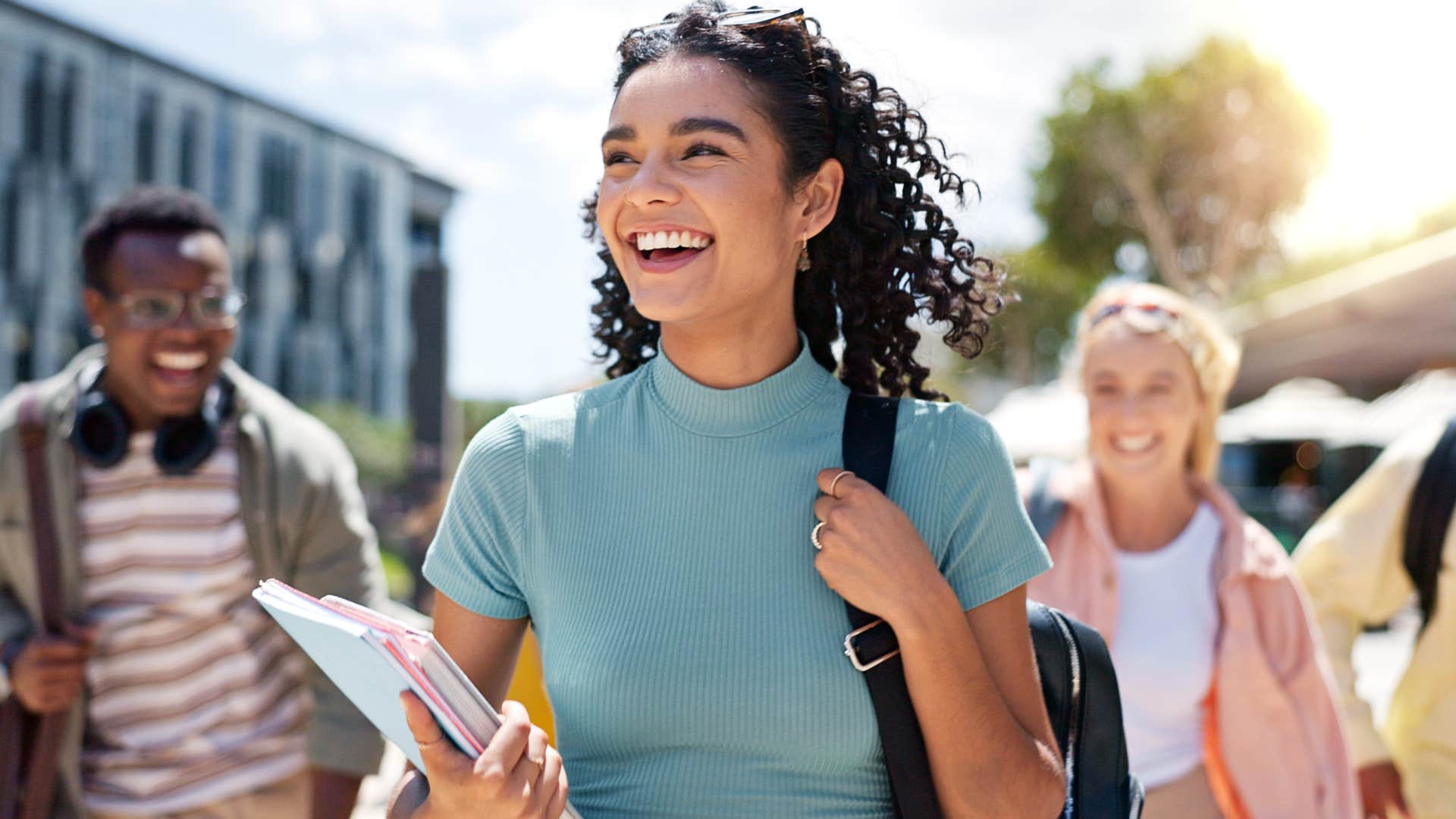 woman following what everyone else is doing smiling
