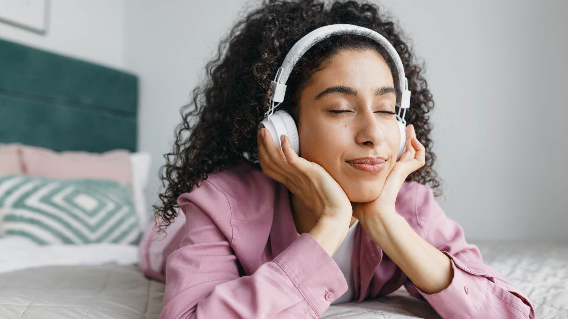 woman listening to artificial nature sounds with headphones