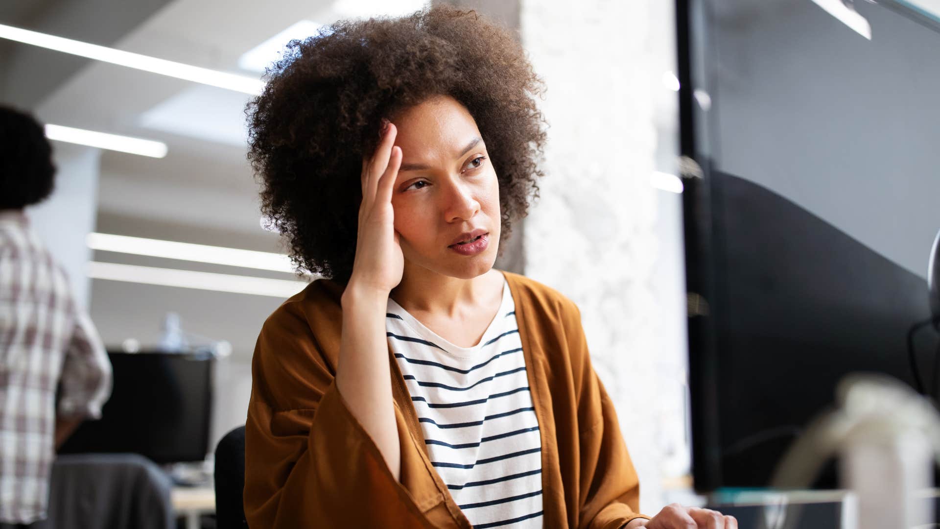 stressed employee waiting to receive her paycheck