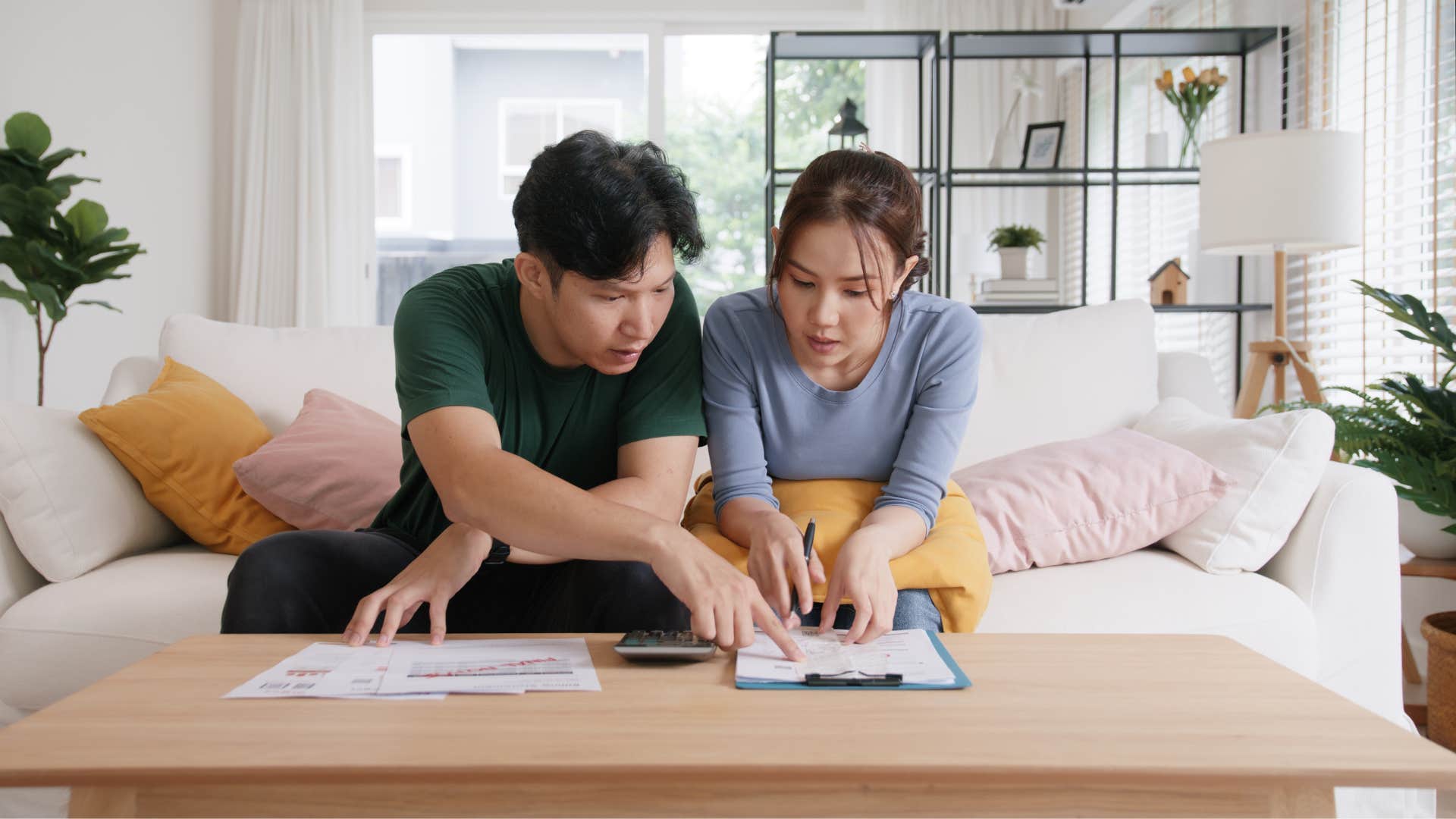 a couple looks over the low interest rates on their savings accounts