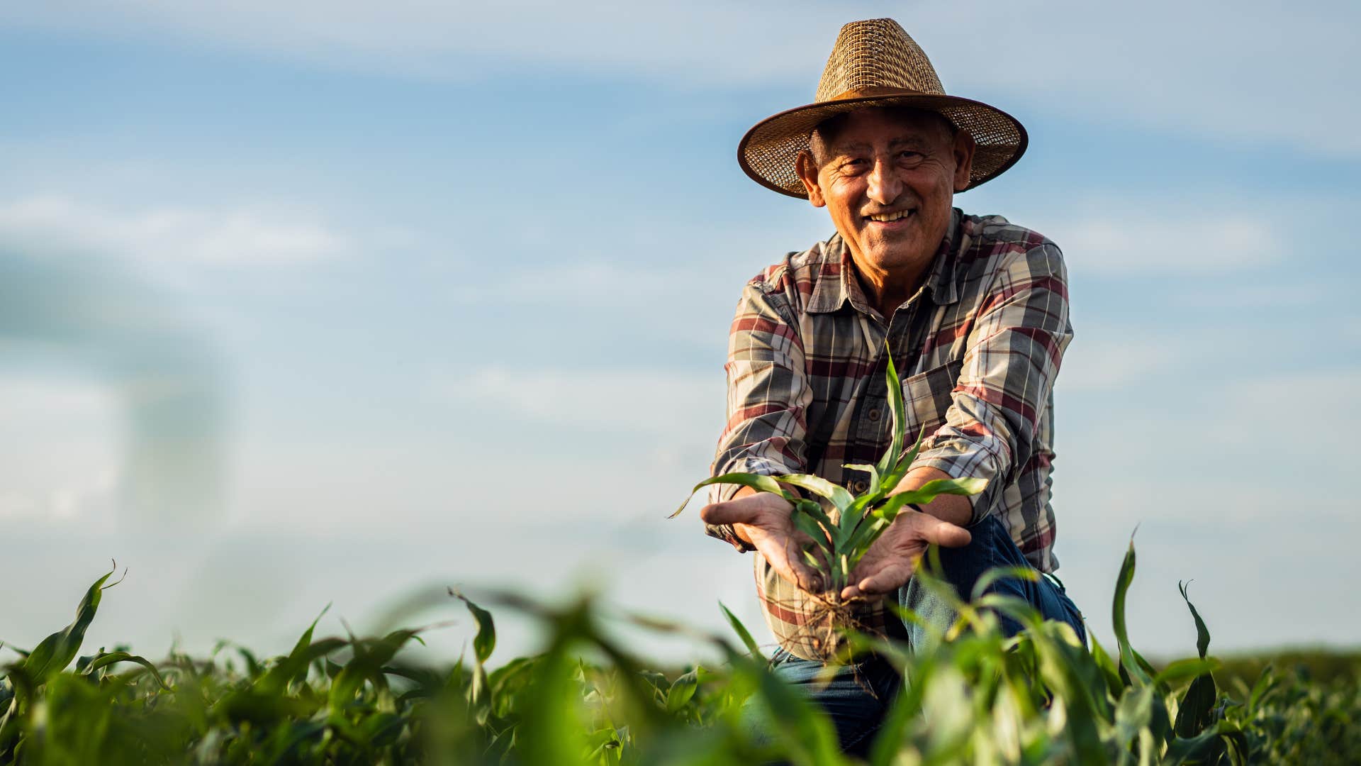 an older man works out on a farm 