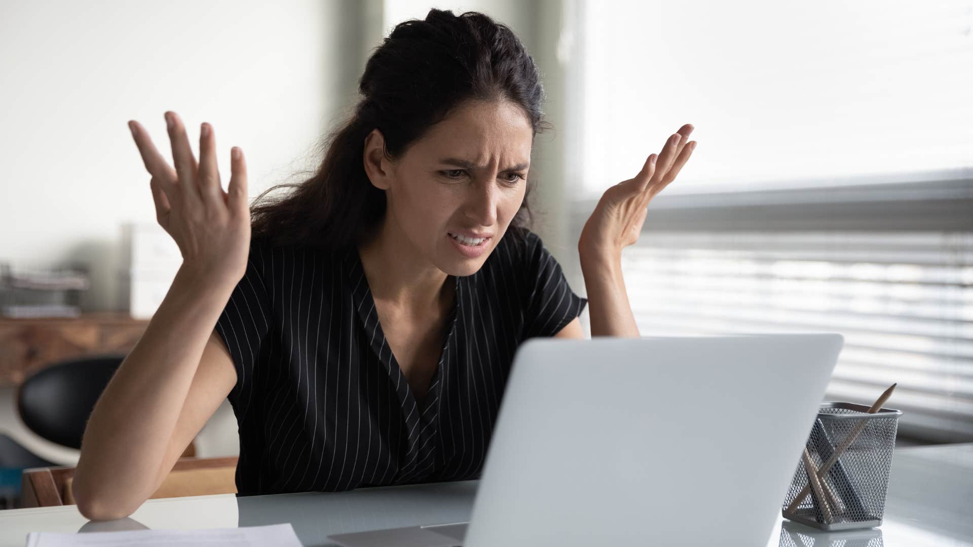 a woman looks at how much interest her loan has accumulated in a short amount time