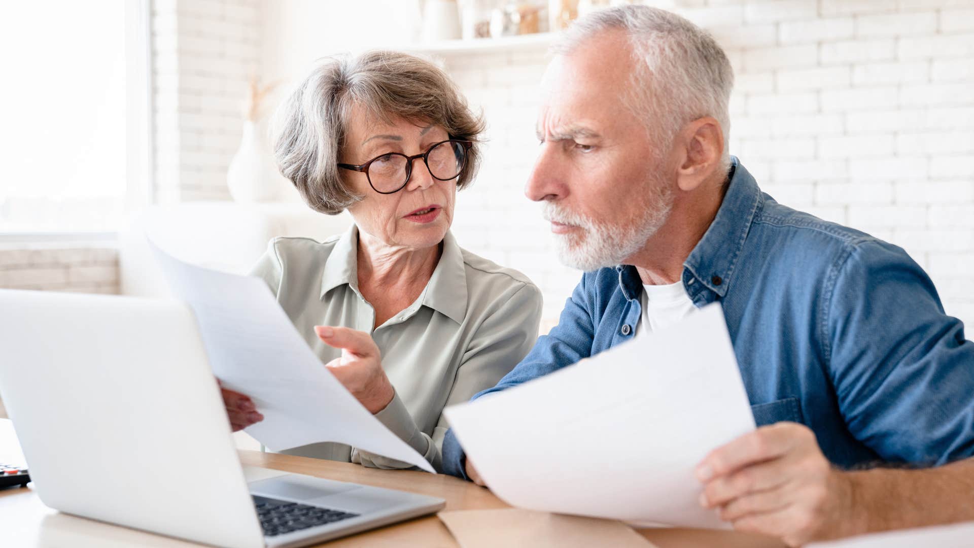 an older couple looks over their social security information