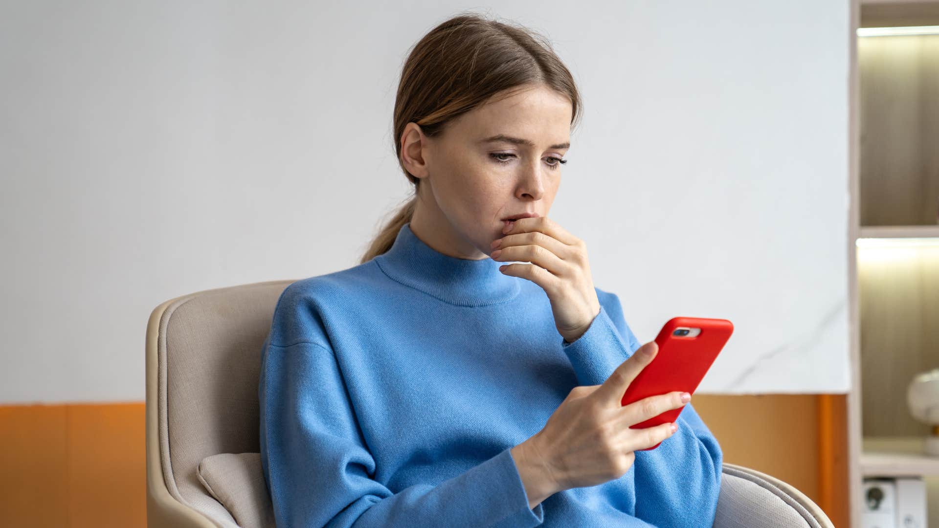 stressed woman overthinking multiple options on her phone