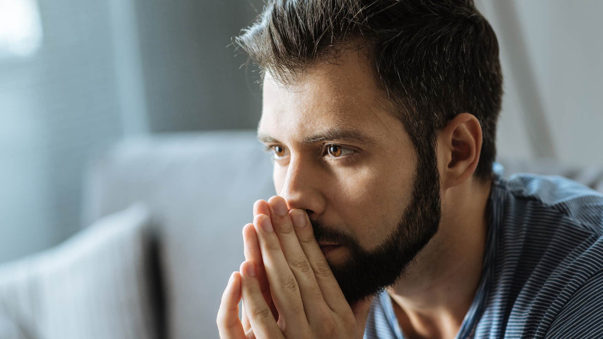stressed man thinking about his regrets