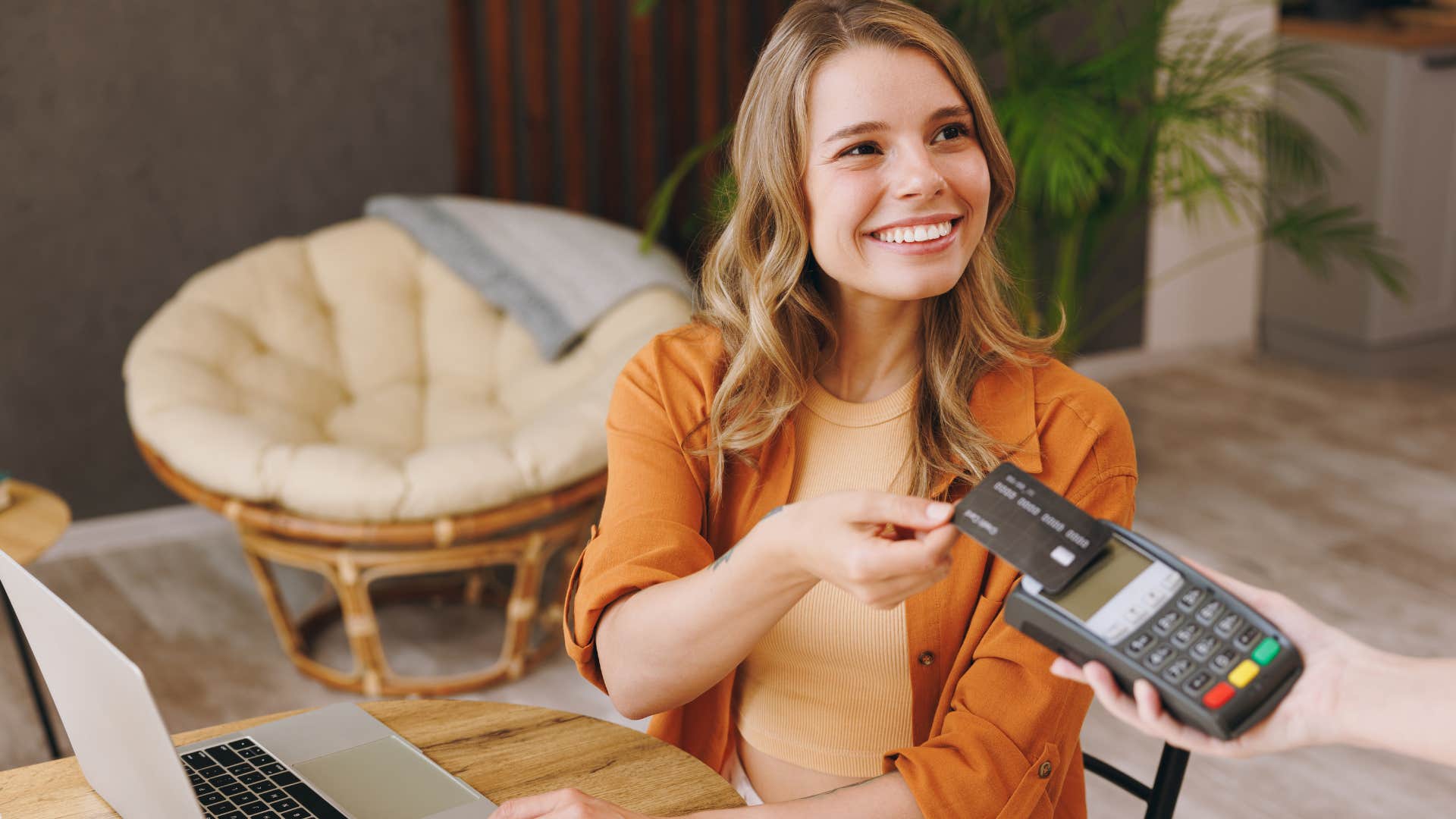 Woman using flashy credit cards to pay.