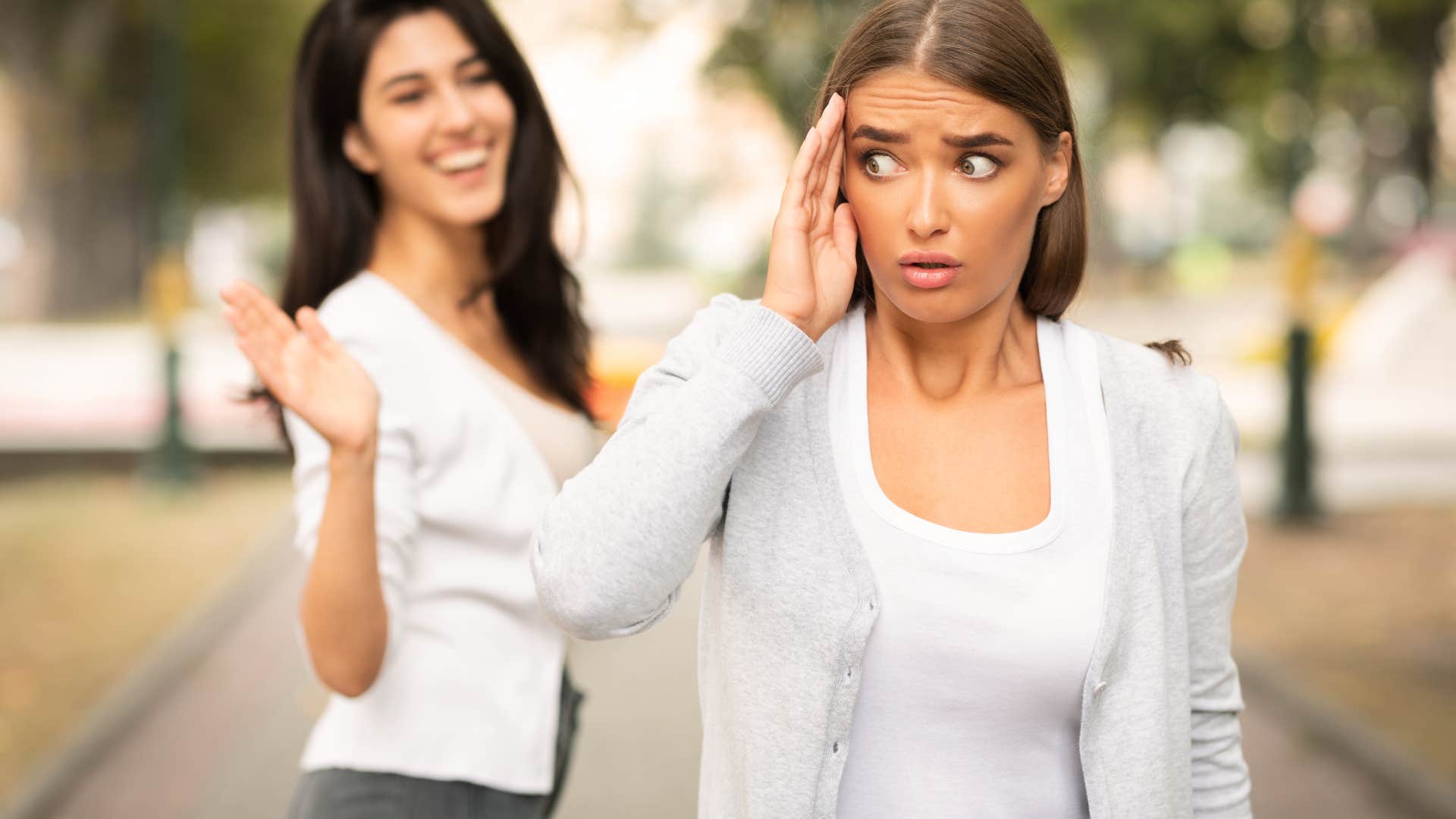 woman running from toxic friend
