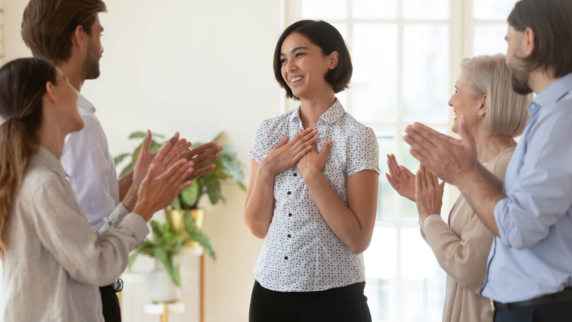 woman who won the race of life being applauded