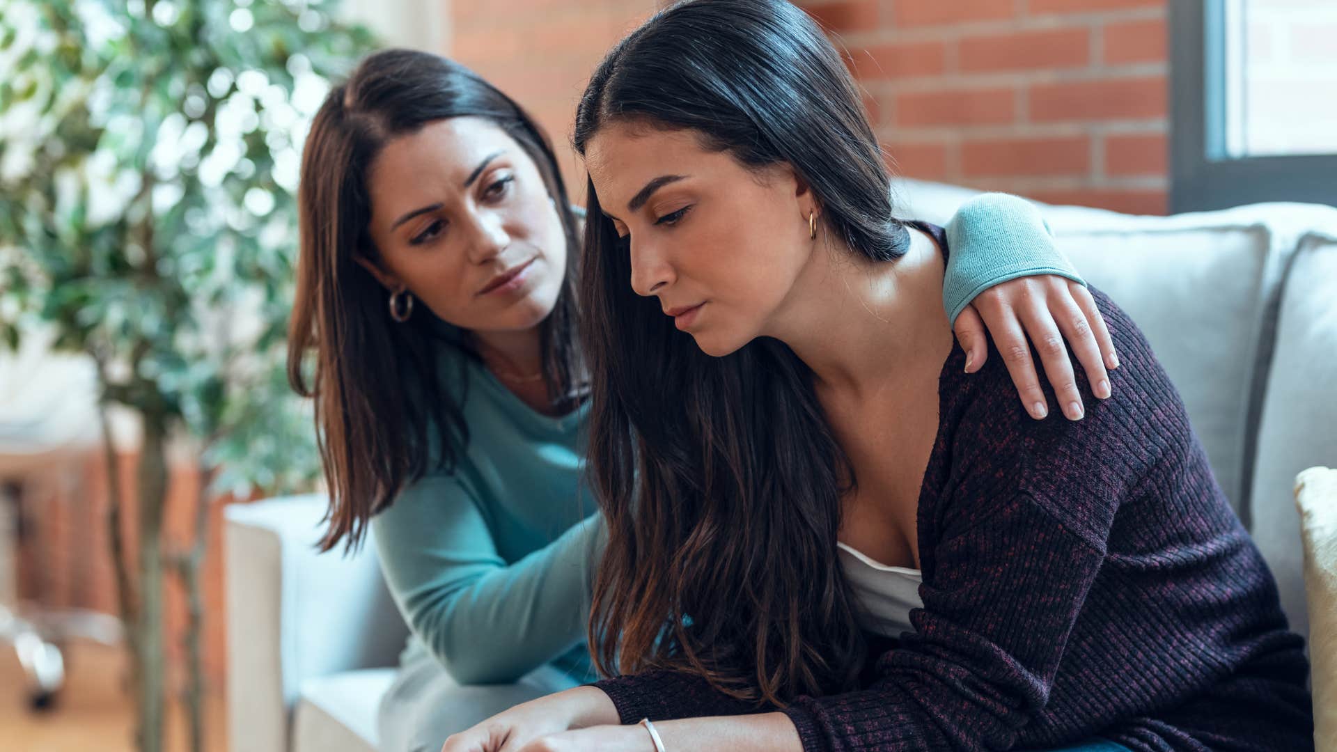 friend comforting friend in dark shirt as she says i've noticed a change in your energy lately is everything okay