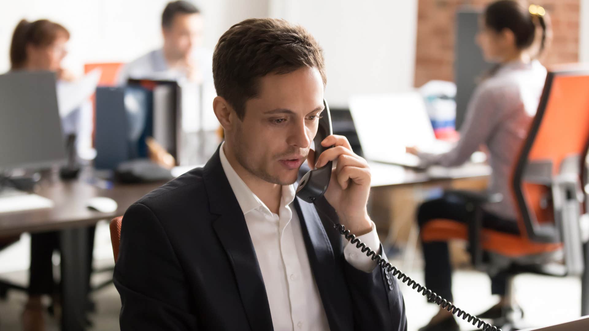 man calling coworker and saying things have been pretty quiet on your end