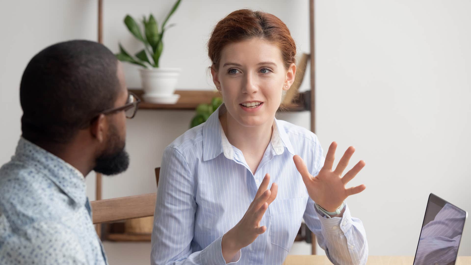 woman in light blue shirt asking man do you think this approach is working well as she looks uncomfortable