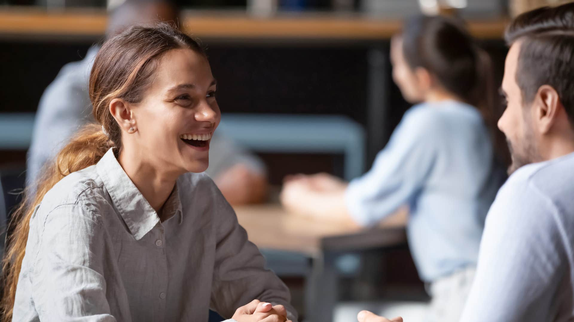 woman being fake nice to man telling him good for you
