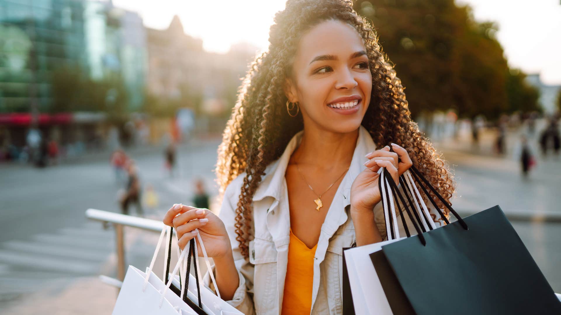 Woman buying flashy designer clothes.