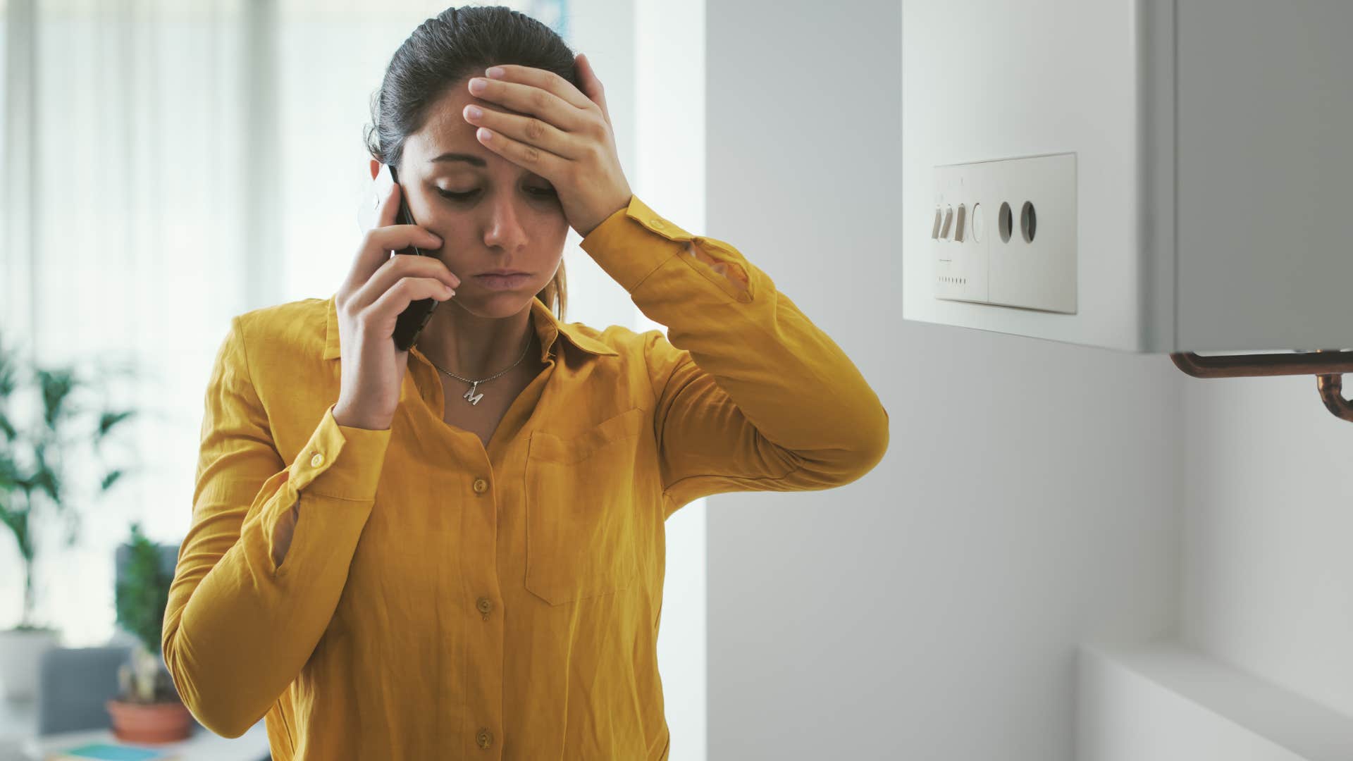 Woman talking on the phone after buying low-quality products.