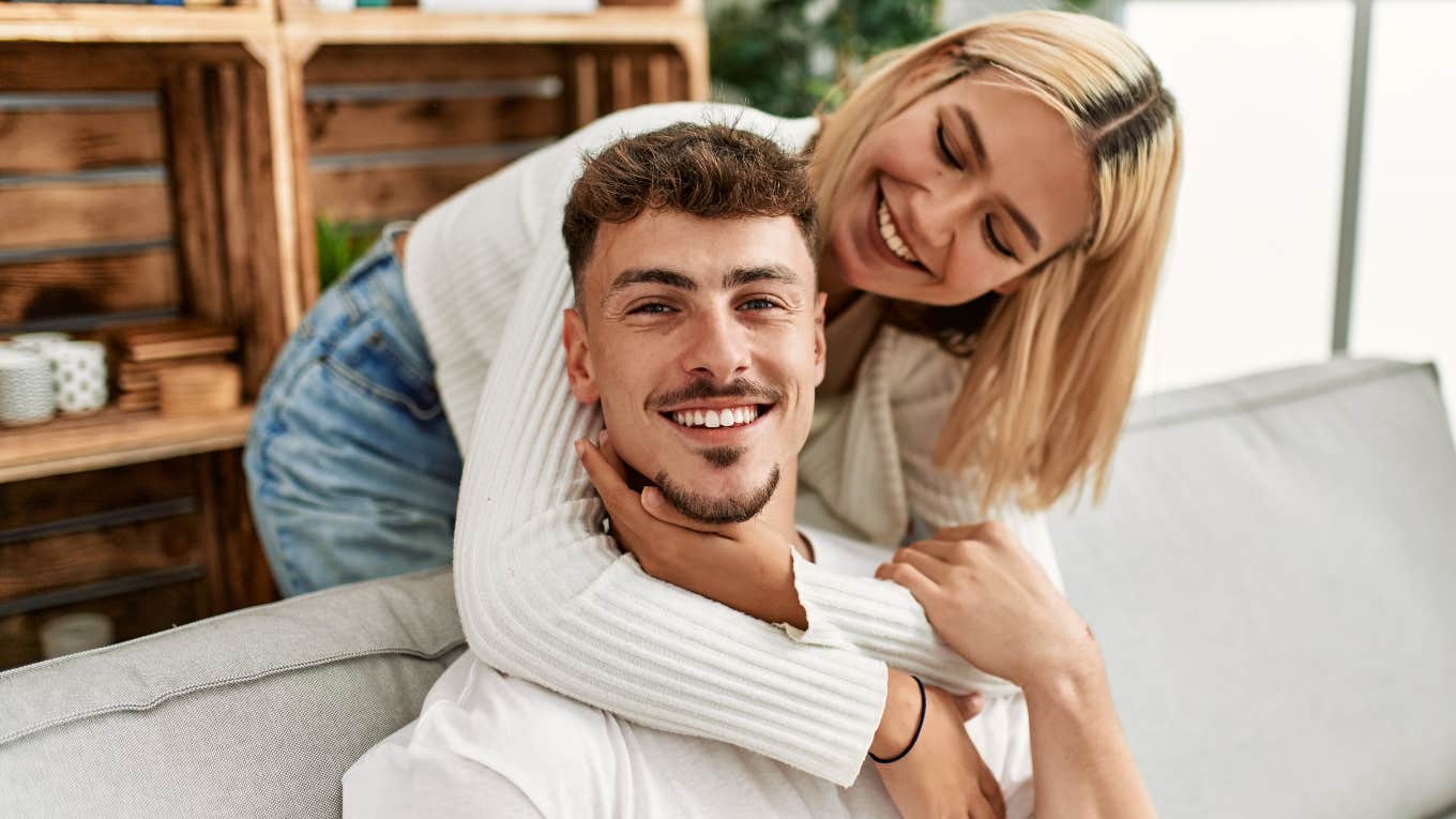 youngest child being hugged by partner