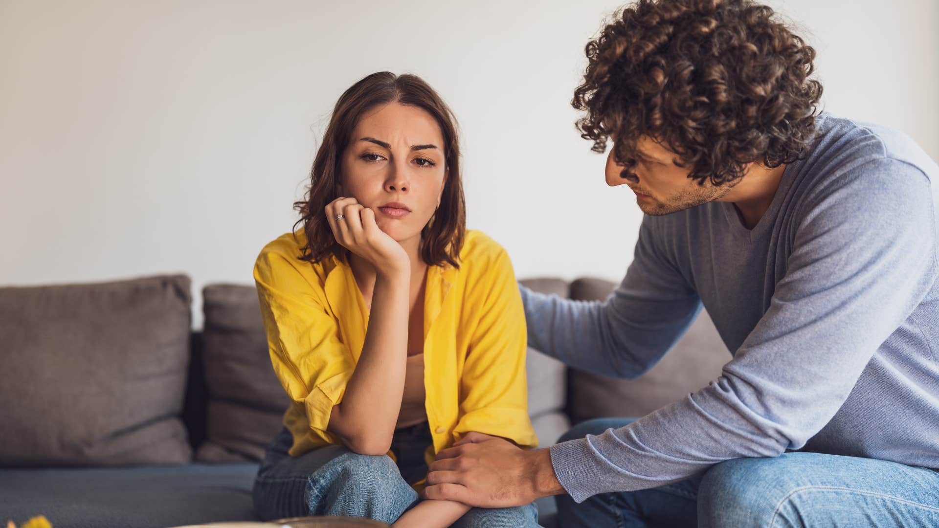 woman and man having lack of shared goals as man tries to talk to her