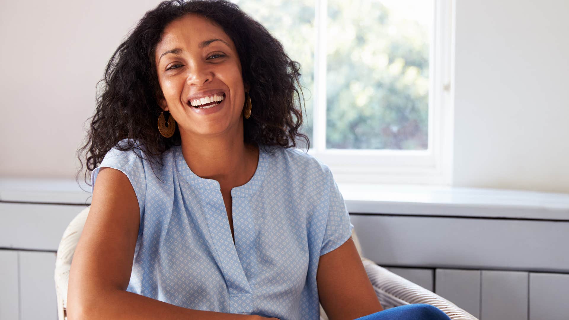 woman with a secure sense of self-worth smiling