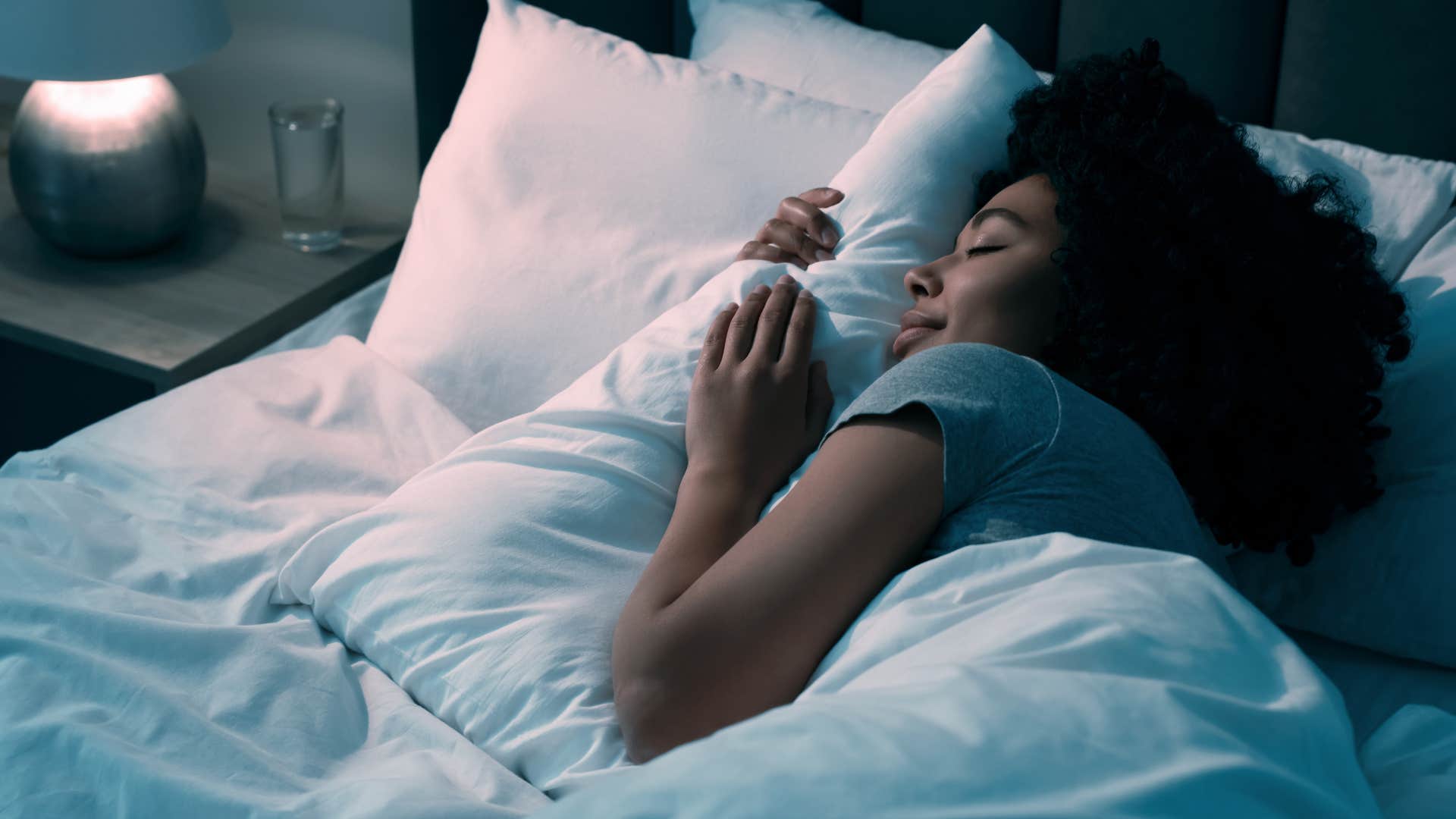 woman having a bedtime routine as she sleeps on bed