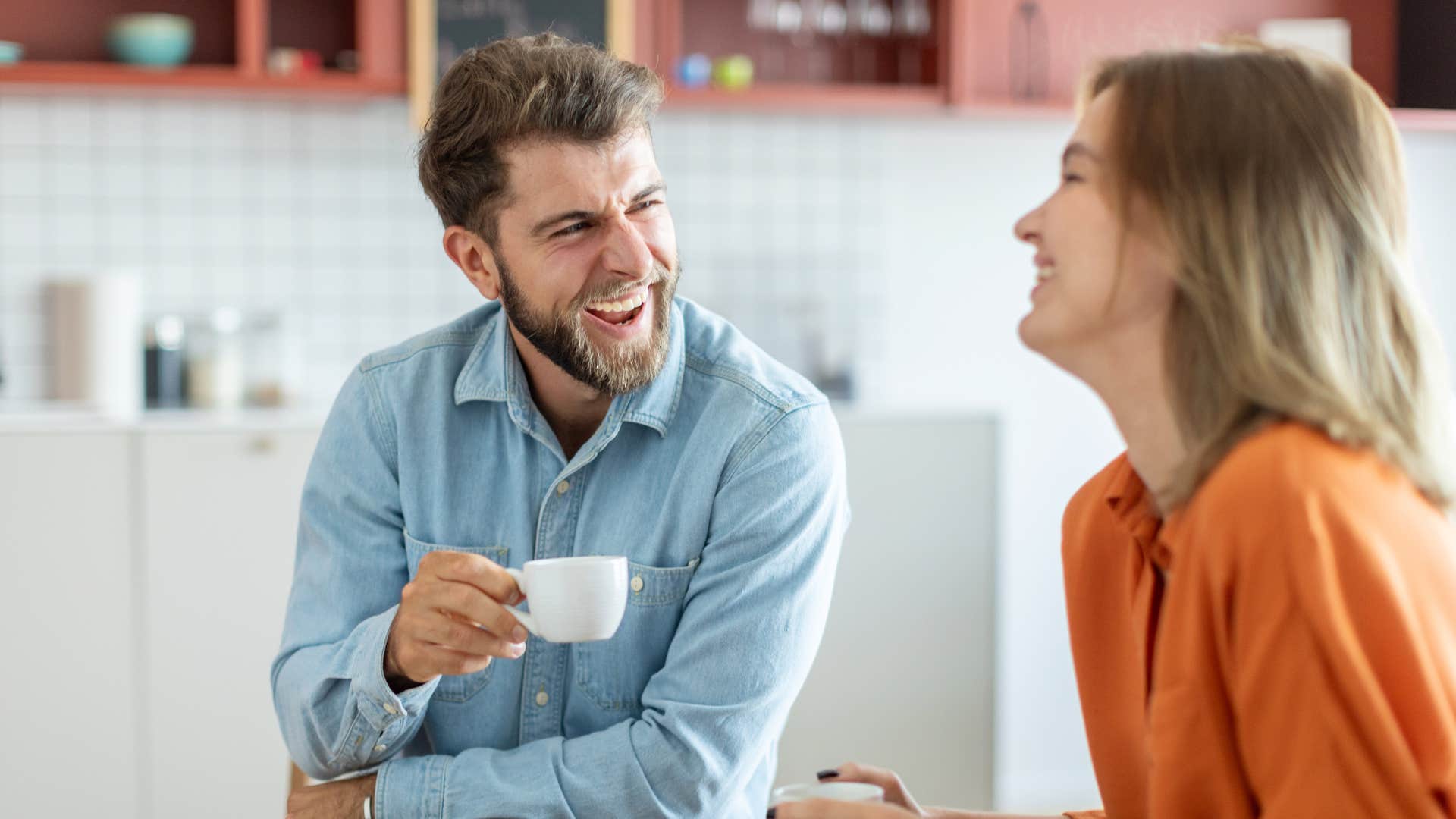 adult man who is the youngest child making his partner laugh