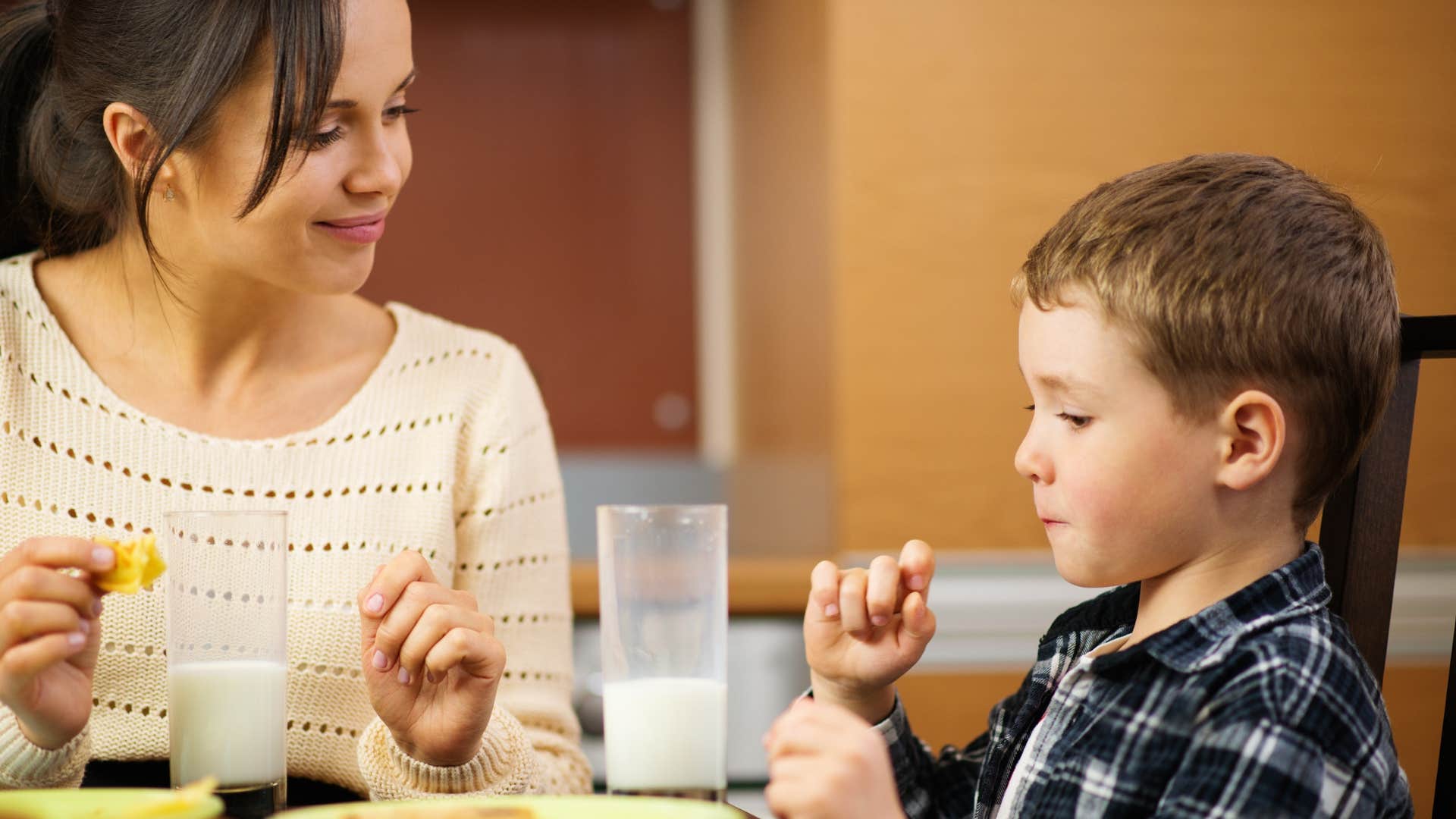 grown adult woman sitting at the kids table
