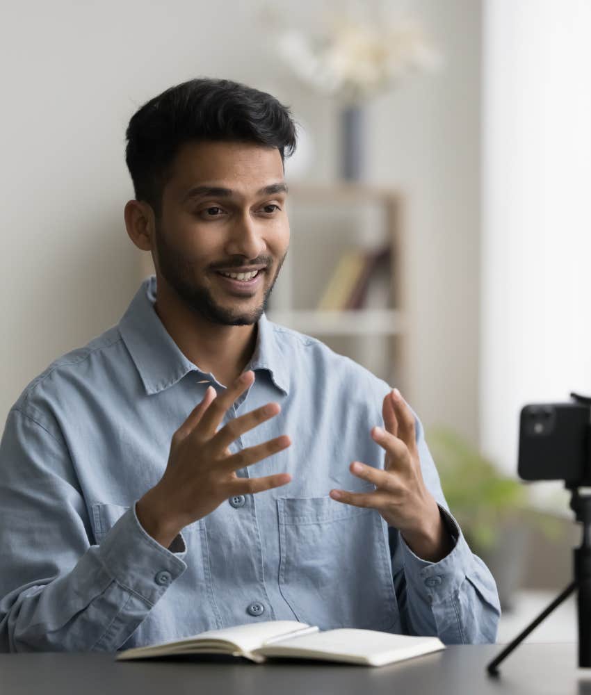 Man recording on phone.