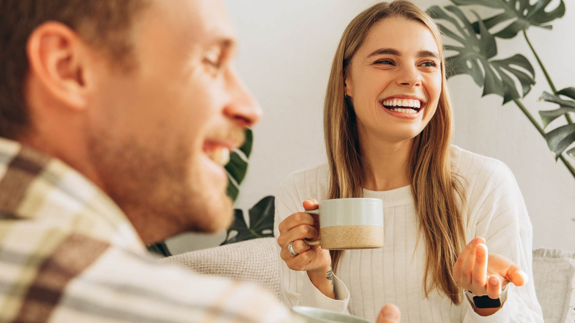 man giving his wife the bigger and better things at a coffee shop