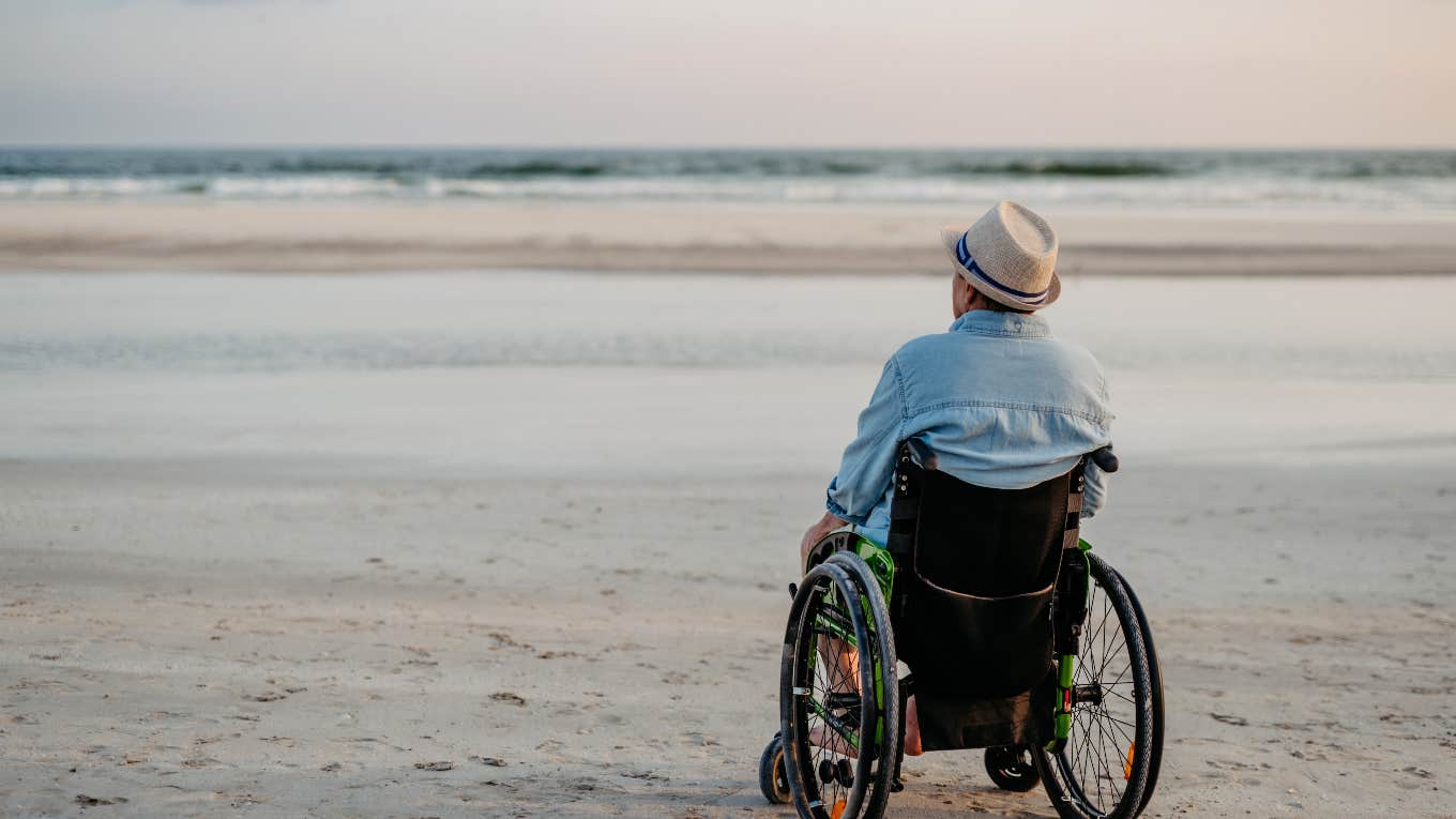 tourist at the beach using a wheelchair