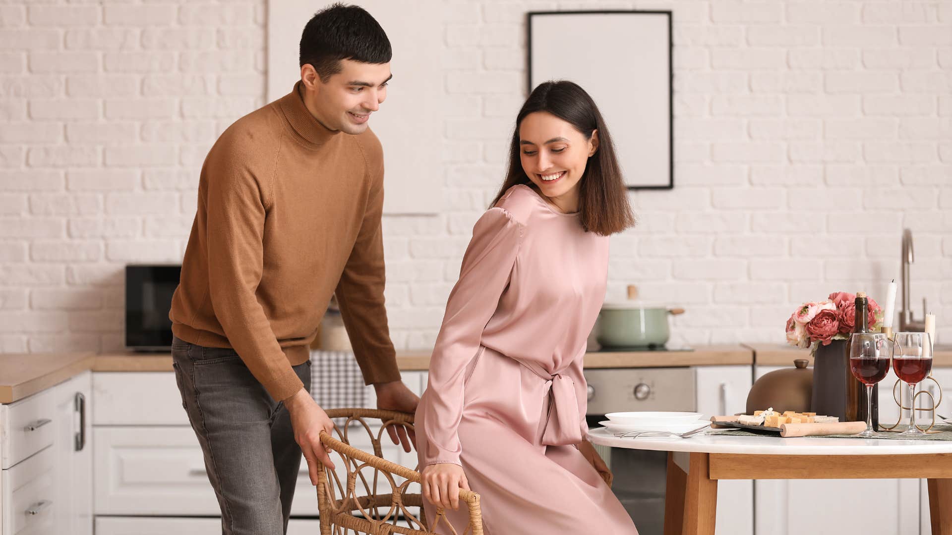respectful man pulling out chair for woman