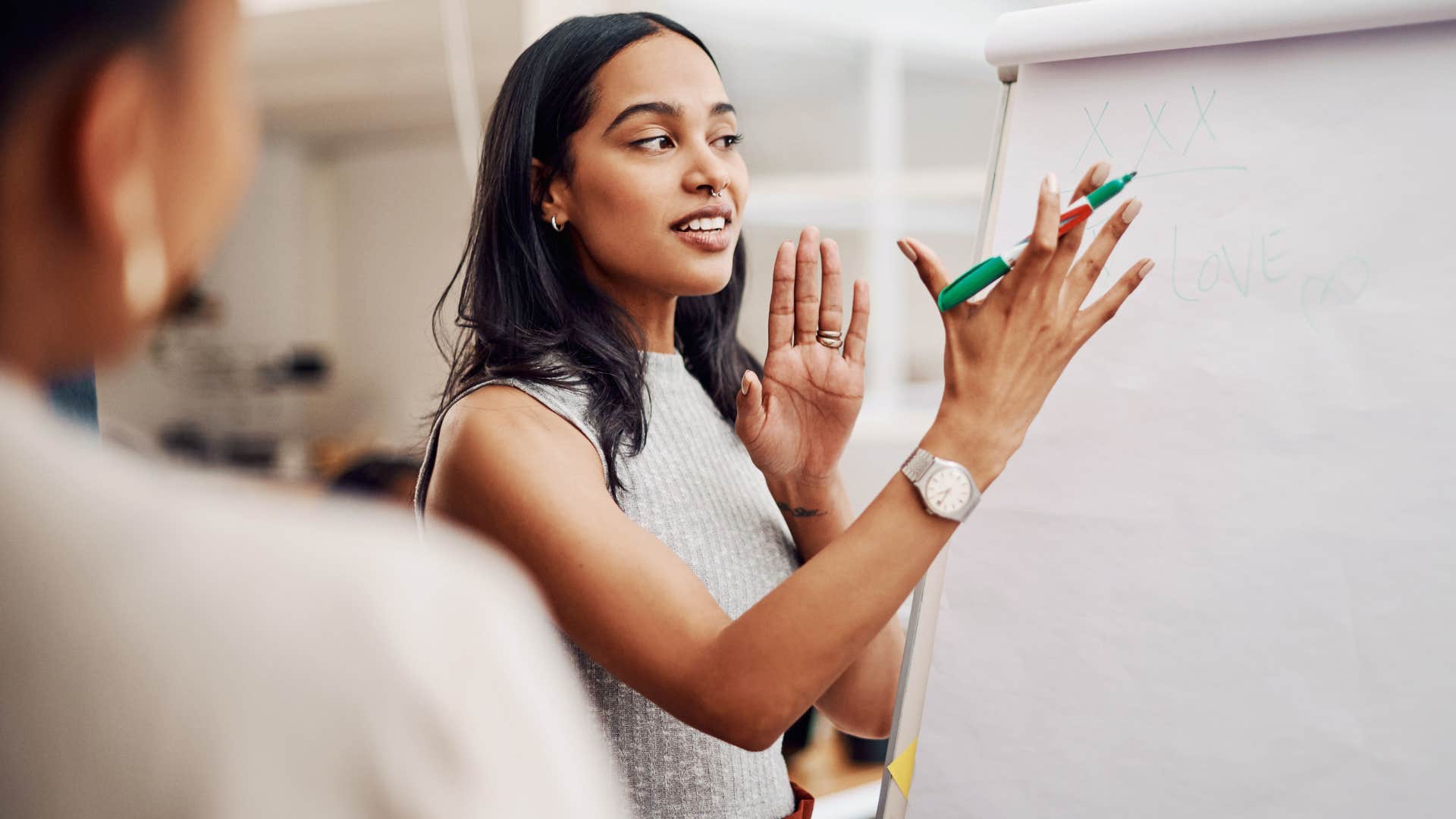 Woman who's overconfident in their abilities talking at work.