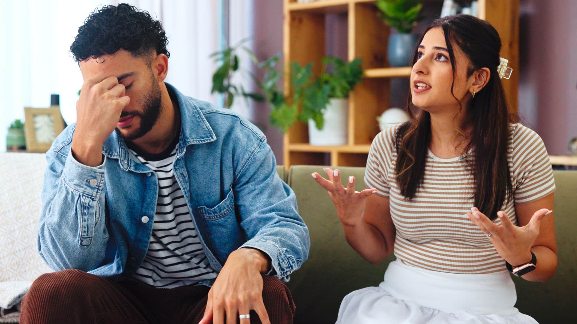 Man turned away from his wife who starts petty arguments.