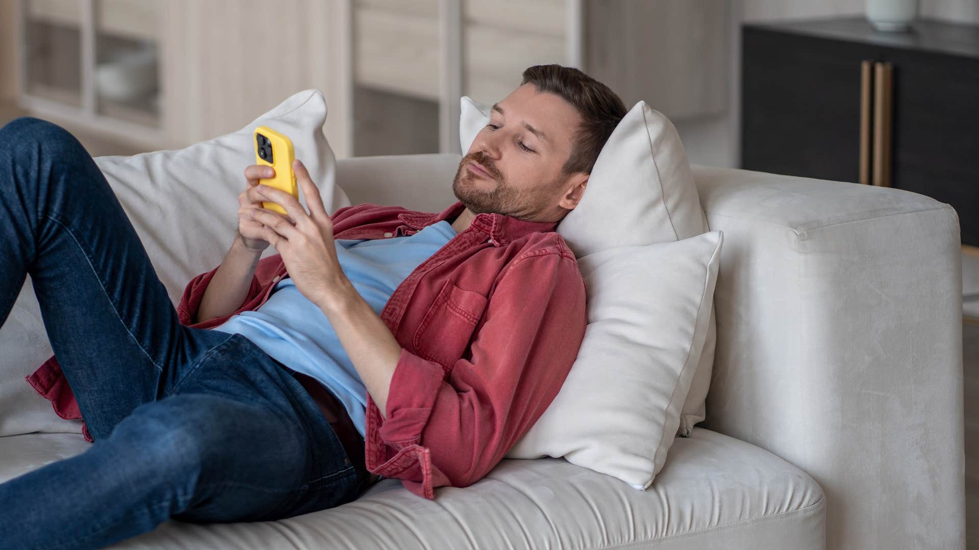 lazy man feeling unmotivated on couch