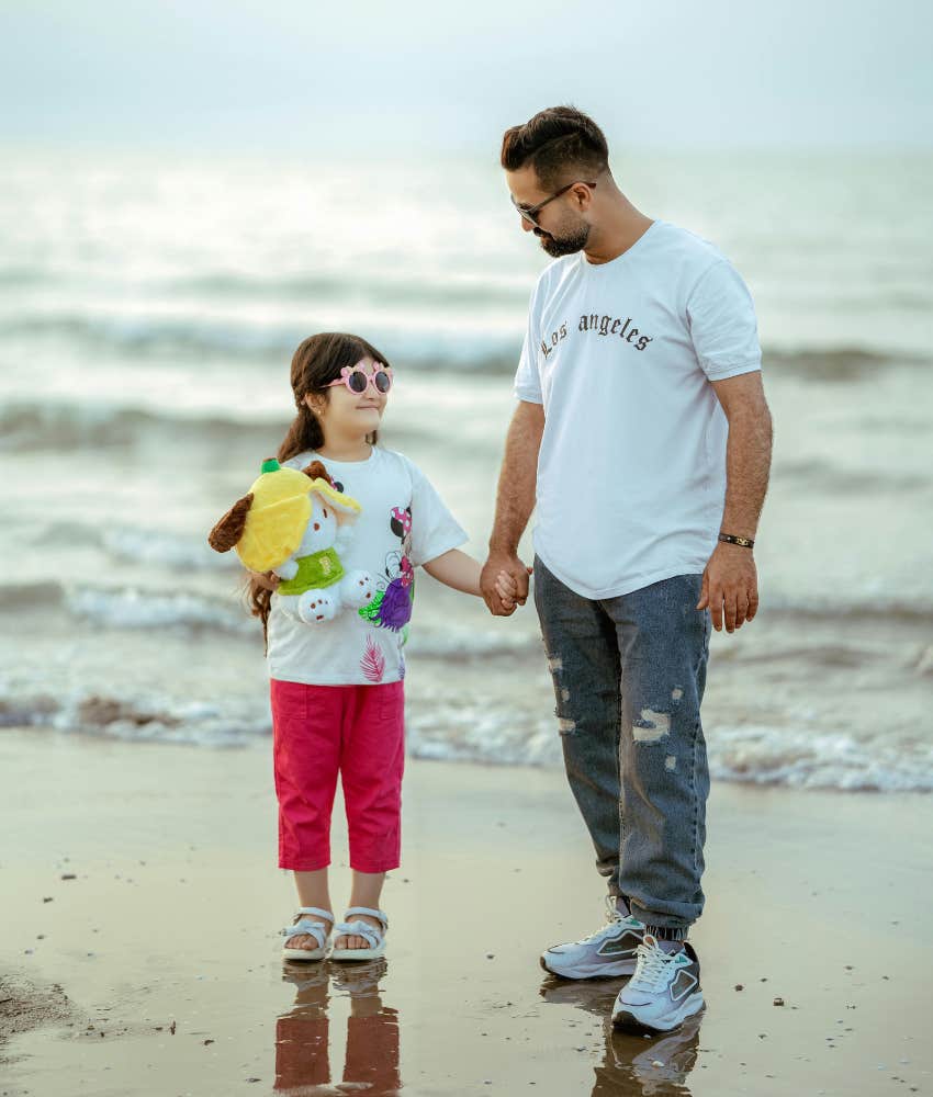 Dad and daughter on a beach vacation experiencing a very different trip than going with girlfriend