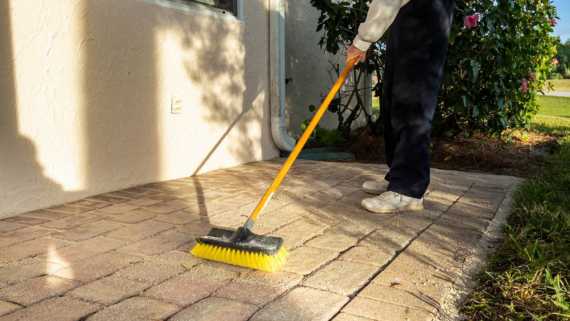 person wanting to feel better off by using the spiritual habit of sweeping front stoop
