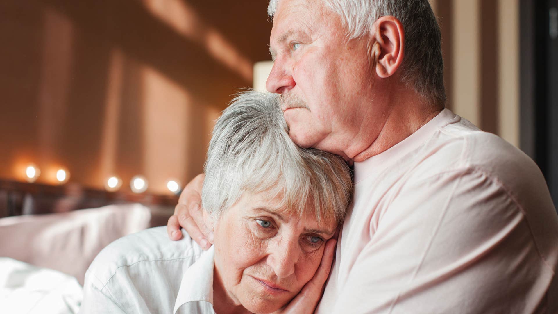 man comforting wife going through mental health problems